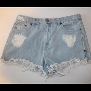 light wash distressed jeans. Size L